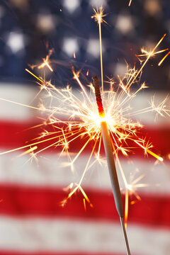 Sparkler ignites in celebration of USA Independence Day. Generative AI image