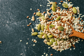 Mixed dry organic cereal and grain seed pile on white background. For healthy food ingredient or...
