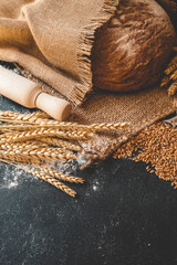 Freshly baked homemade bread and ears of wheat