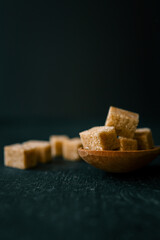 brown sugar heap and wooden spoon