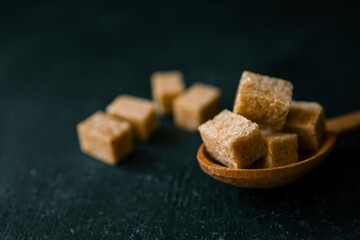 brown sugar heap and wooden spoon