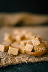 brown sugar heap and wooden spoon