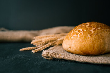 Freshly baked homemade bread and ears of wheat