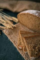 Freshly baked homemade bread and ears of wheat