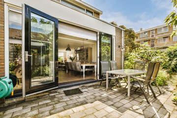 Modern home with opened glass doors in Amsterdam