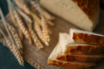 Freshly baked homemade bread and ears of wheat