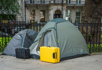 Homelessness in big cities. Tourists or homeless people sleeping in a tents in a streets of London © Milos