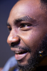 Obraz premium Ecstatic african american gamer having fun in gaming room, playing videogames on computer. Extreme close up shot of excited BIPOC esports player performing in gaming tournament from home late at night
