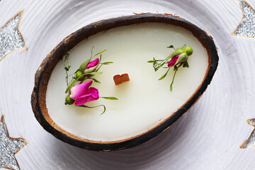 original decorative candle in a coconut. natural soy wax candle 