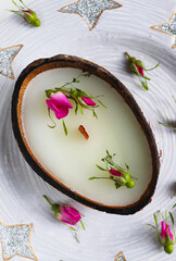 original decorative candle in a coconut. natural soy wax candle