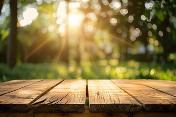Empty wooden table with blurred greenery and sunlight in the background. Outdoor nature scene with copy space. Summer and natural concept for design and print