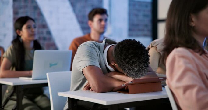 Tired, man and university class with sleeping student in college class and lecture with burnout. Teen, youth and nap in study hall with classroom prep for exam with tablet and brain fog from learning