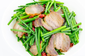 A dish of fried leek moss with bacon