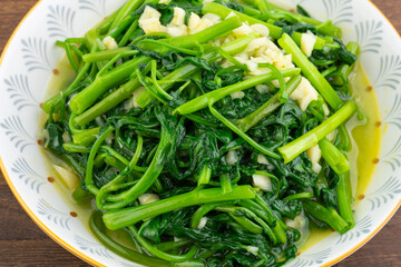 A dish of garlic water spinach