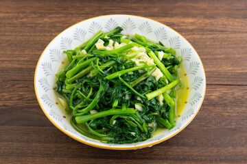 A dish of garlic water spinach