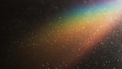 Obraz premium Blur colorful warm rainbow light leaks on black background with dust texture. Defocused abstract damaged scratched retro film analog effect for using over photos as overlay or screen filter