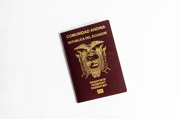 Close-up photo of the cover of a brown ecuadorian passport from the country of Ecuador in South America-Latin America, with gold lettering, on a white background