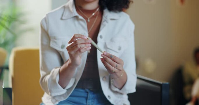 Woman, hands and marijuana with rolling of joint for mental health, high and benefits in smoking. Cannabis, relax and female person with preparation of weed in house for natural, support and healing
