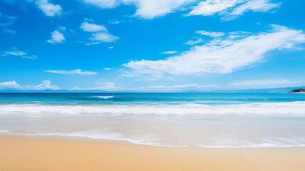 Obraz premium A picturesque beach featuring clear blue skies, sandy shores, and gentle ocean waves