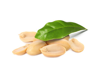 Peeled peanuts and leaves isolated on white