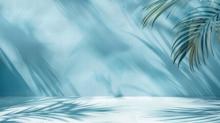 Obraz premium Blurred shadow from palm leaves on light cream wall. Minimalistic beautiful summer spring background for product presentation. 