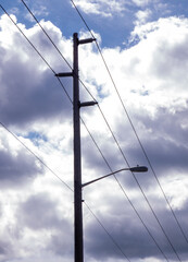 pylon against sky with clouds