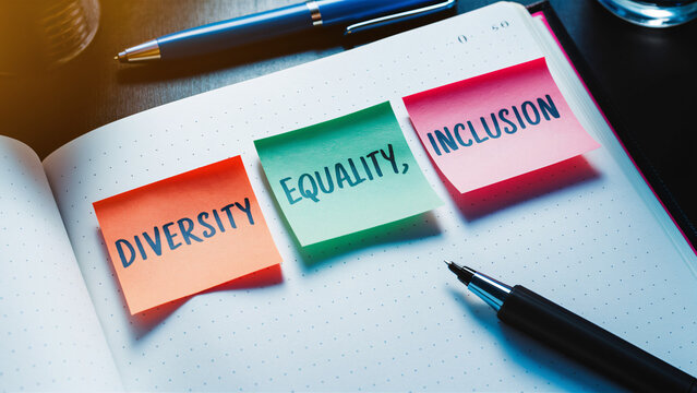 Diversity, Equality, Inclusion - Conceptual Desk Setup with Sticky Notes for DEI Awareness and Office Motivation