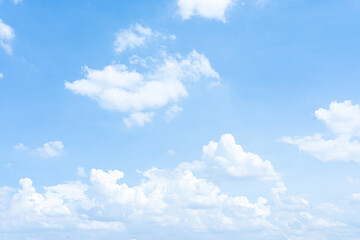 Blue Sky with Fluffy White Clouds on a Sunny Summer Day