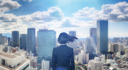 日本の街・都市・朝日を受けたオフィスビル群を前に佇み風を受けて髪をなびかせるスーツを着た会社員の女性の出勤　ビジネス・はじまり・決意・目標・挑戦のイメージ