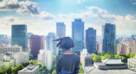 日本の街・都市・朝日を受けたオフィスビル群を前に佇み風を受けて髪をなびかせる会社員の女性の出勤　就職・ビジネス・はじまり・決意・目標・挑戦のイメージ