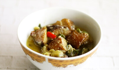 Mangut of smoked stingray or smoked fish in a spicy and creamy sauce. Mangut ikan pari. Indonesian food.