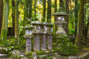 Japanese stone pillars line the walkways in the park.