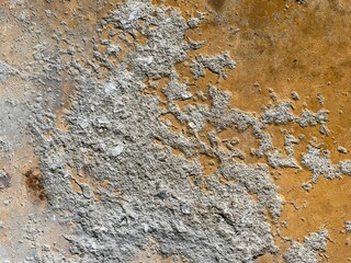 a photography of a close up of a wall with a clock on it.