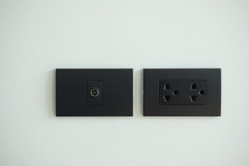 Black electrical outlet and inserts the antenna cable to the TV outlet. Element of modern interior...