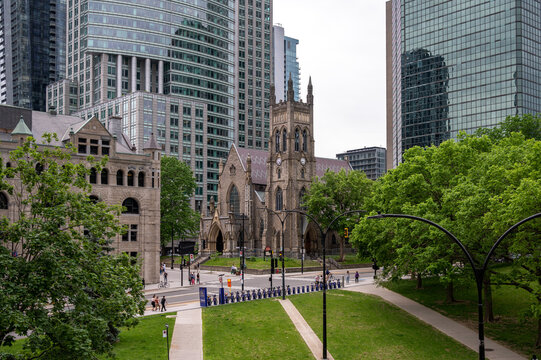  St. George's Anglican Church in Montreal surrounded by skyscrapers.