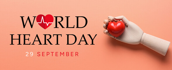 Wooden hand with red heart on color background. Donation concept