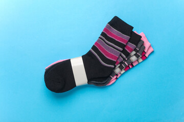 Colored socks on a blue background