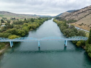 Bridge crossing the Clutha river in Ettrick-Raes Junction, Milllers Flat, Otago, New Zealand.