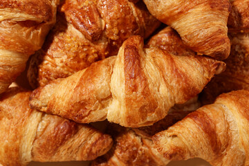 Texture of tasty croissants as background, closeup
