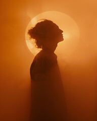 Silhouette of a Person Against a Golden Sunset