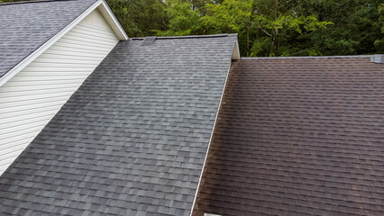 New roof and old roof on house, showing comparison of the two. © Chad Robertson