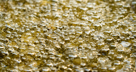 closeup of hot bubbling boiling oil background.