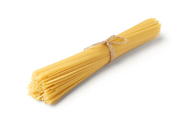 Tasty raw spaghetti pasta on white background