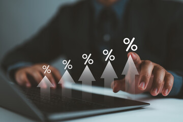 Interest rate and dividend concept, businessman use laptop with calculate income and return on investment in percentage. Return on stocks and mutual funds, long term investment.