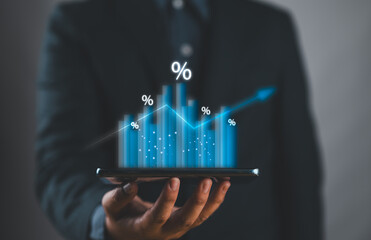 Naklejka premium Businessman holding growth graph with percent symbol for increase in interest rates and dividends, return on stocks and mutual funds, long term Investments for retirement