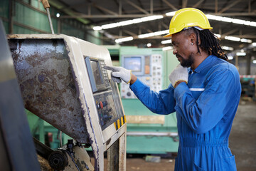 engineer or technician checking and control lathe machine in the factory