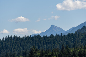Obraz premium Green mountains and beautiful sky clouds under the blue sky