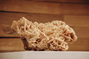 A desert rose, an intricate rose-like formation of crystal clusters of gypsum or baryte, which include abundant sand grains.