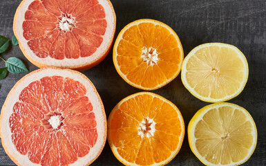 Citrus fruit halves on the table. Preparing citrus juice.