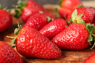 Sweet fresh strawberries on wooden background, closeup
